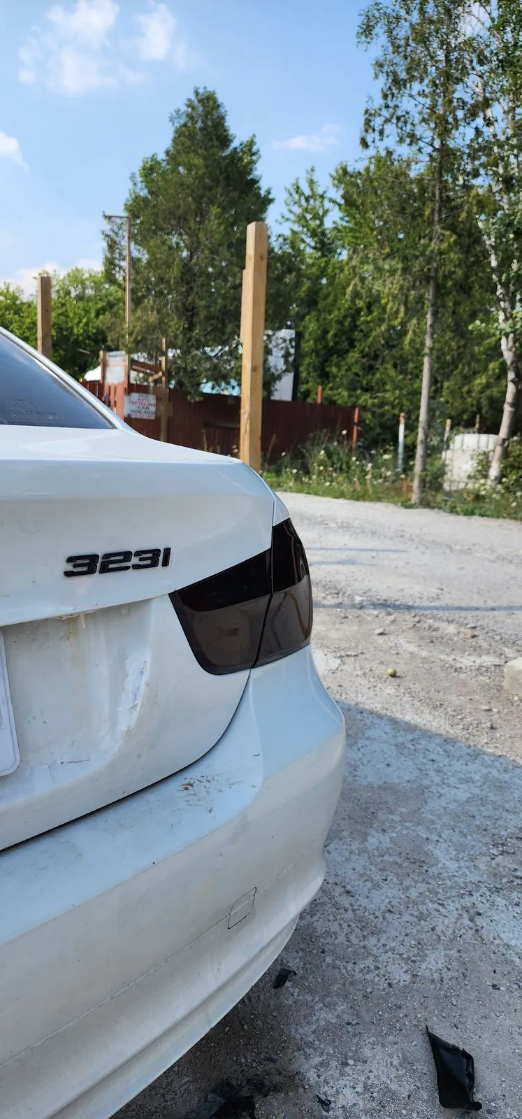 Smoked taillight tint detail on a white BMW