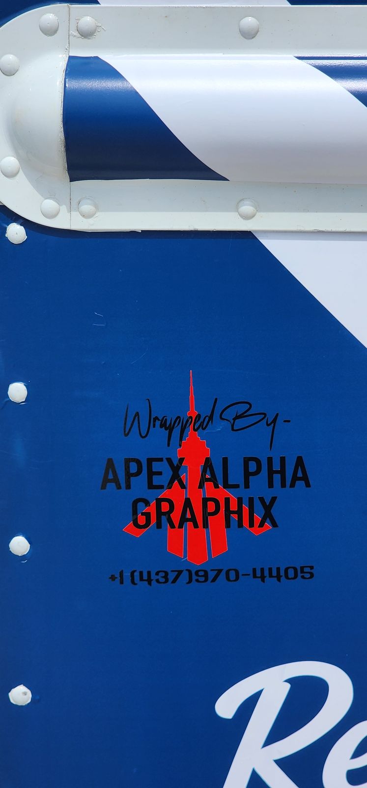 Wrapped by Apex Alpha Graphix credit decal on the food truck wrap