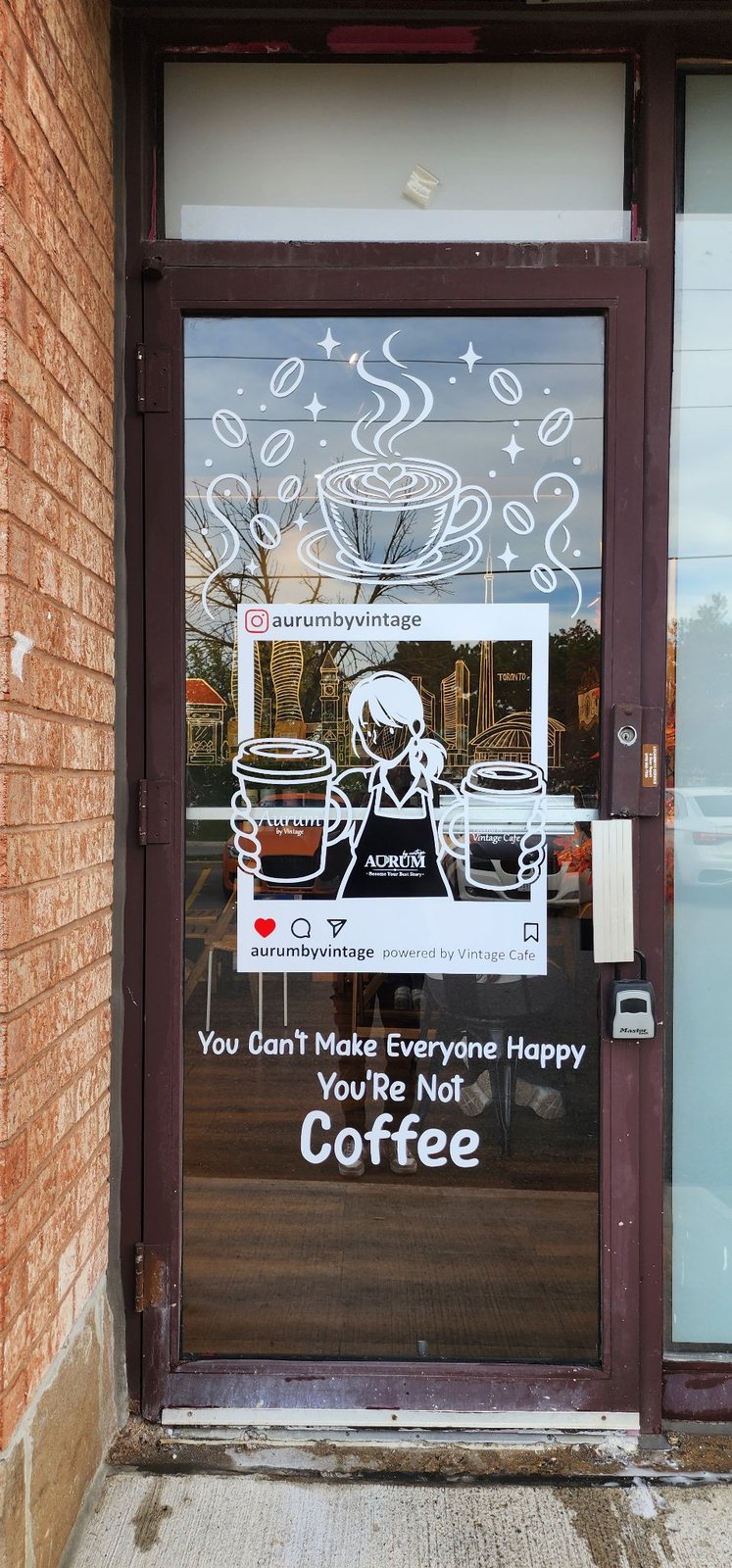 Coffee shop entry door with vinyl artwork