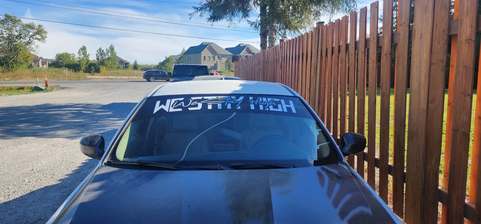 Windshield banner fitted on a car in Toronto
